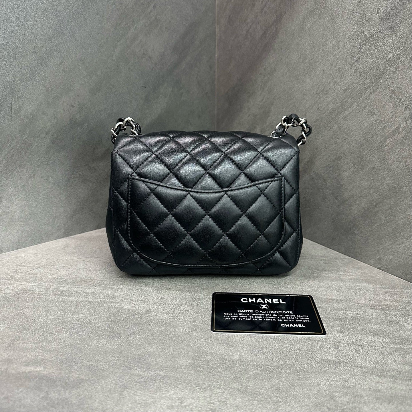 Chanel CF Square Flap Bag Black and Silver Lambskin Chain Bag 28 with Card. The bag has a structured shape and a clean interior.