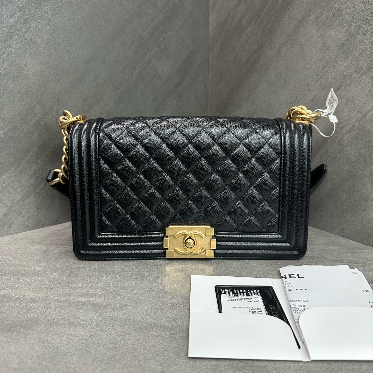 Chanel Le Boy Medium Black Gold Caviar Leather Chain Bag 28 with Card and Receipt. The bag has a structured shape and a clean interior.
