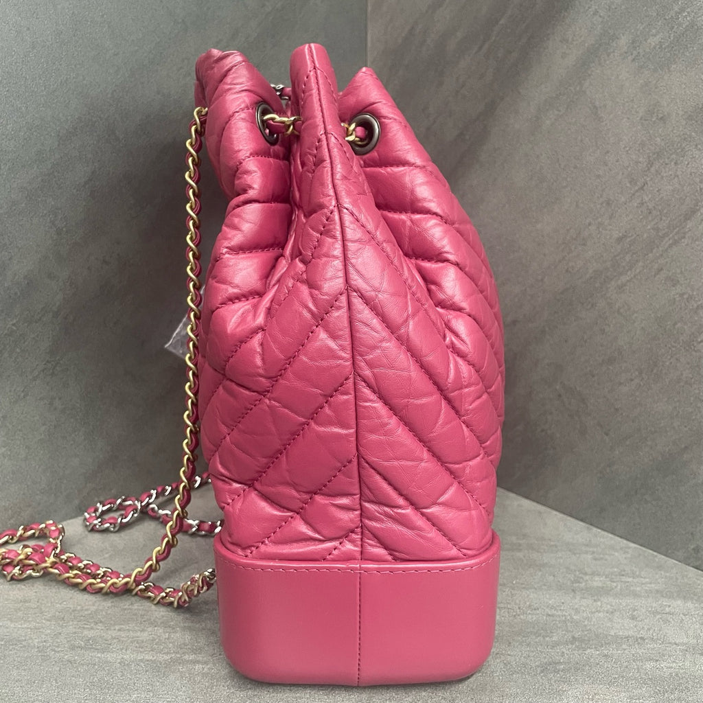 CHANEL Raspberry Pink V-Wave Mini Flap Bag with Crossbody Chain, 26 openings with card, in stock at a great price.
