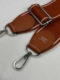 Hermès Evelyne in gold-brown Togo leather, with silver hardware. 98% new classic large H perforated logo design, accompanied by an adjustable shoulder strap.