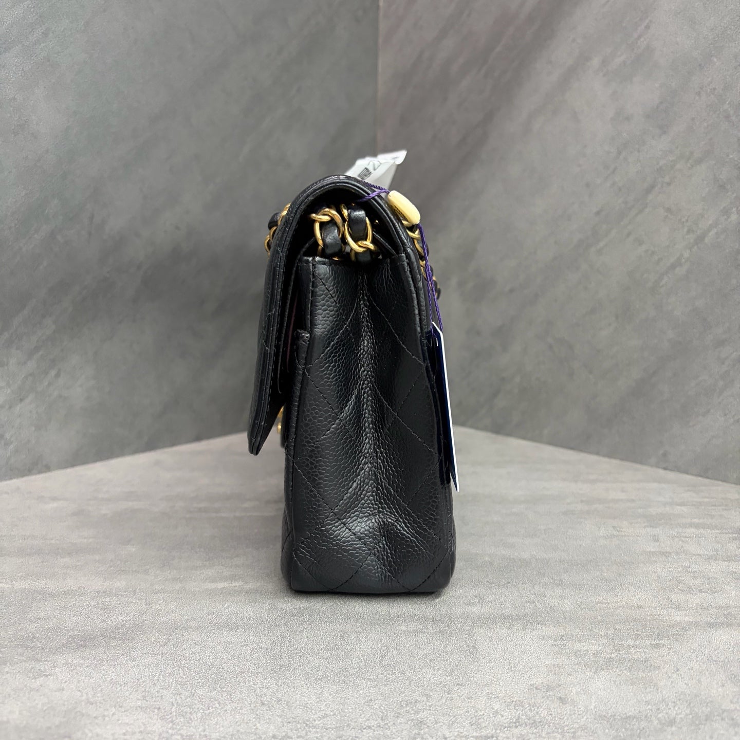 Chanel CF black gold lychee leather medium 26 open without card. The shape is three-dimensional and the interior is clean. Available in stock.