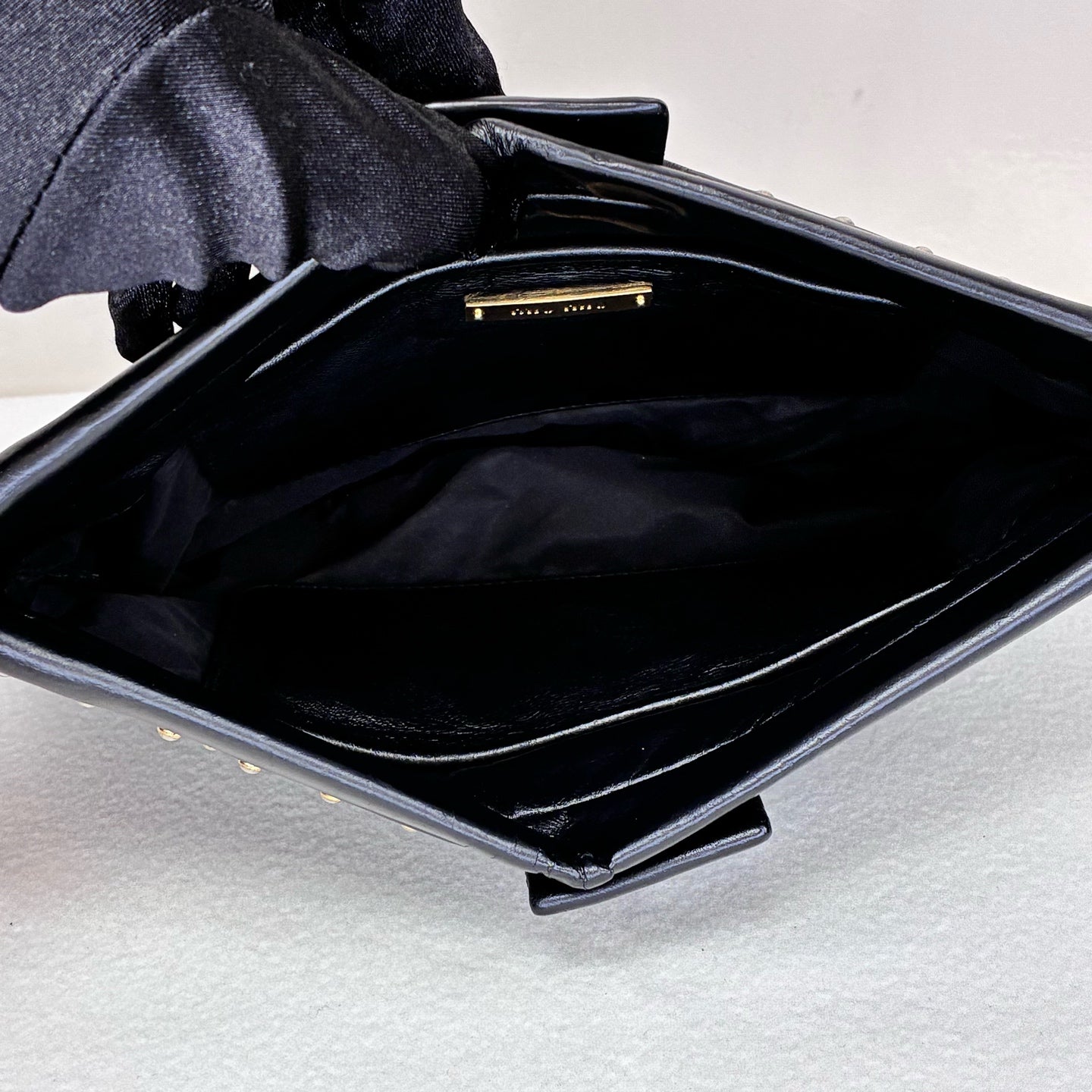 Miu Miu 95% new black studded clutch with gold stud embellishments, size: 18*14*5cm.