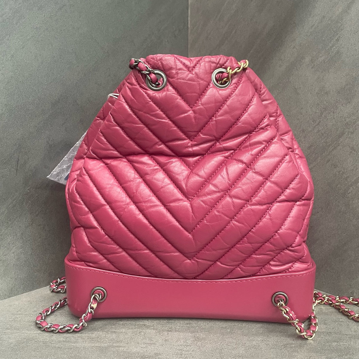 CHANEL Raspberry Pink V-Wave Mini Flap Bag with Crossbody Chain, 26 openings with card, in stock at a great price.