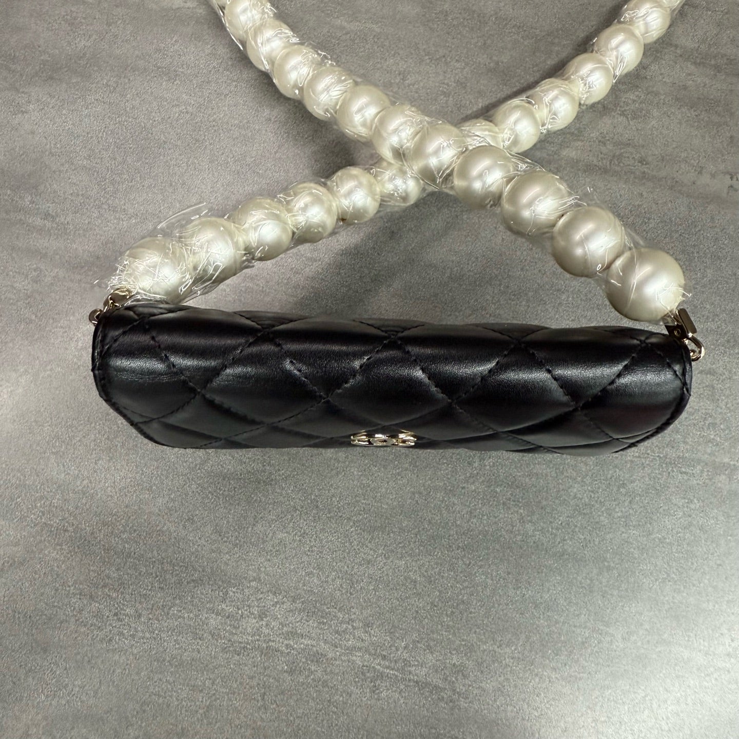 Chanel Chanel large pearl chain mini woc 31 open strap card in original condition