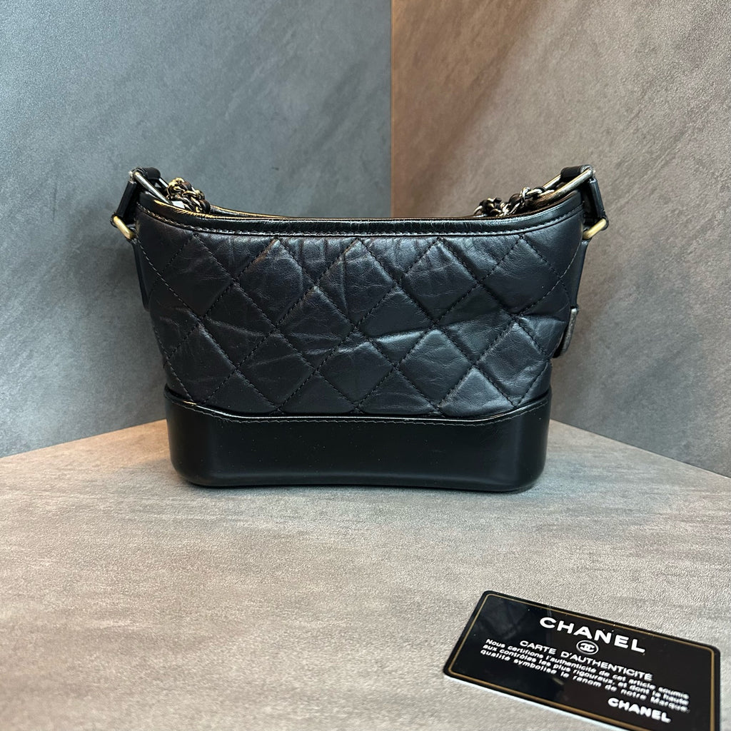 Chanel Black and Gold Small Gabrielle Bag, 25 serial with authenticity card, structured silhouette, clean interior