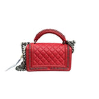 Chanel Red Le Boy Small Handbag, Palace Edition, 23-Opening with Card and Ticket. The bag shape is three-dimensional and full, with no wear on the corners.
