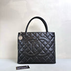 Chanel Hilton Black Tote Bag, Pebbled Calfskin, Classic Double C Embossing, Hand Carry Style, Large Capacity, Practical for Commuting