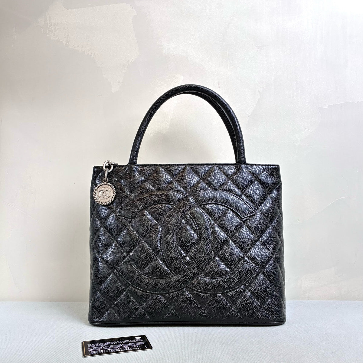 Chanel Hilton Black Tote Bag, Pebbled Calfskin, Classic Double C Embossing, Hand Carry Style, Large Capacity, Practical for Commuting