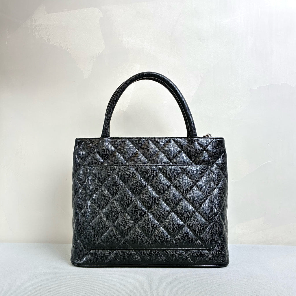 Chanel Hilton Black Tote Bag, Pebbled Calfskin, Classic Double C Embossing, Hand Carry Style, Large Capacity, Practical for Commuting