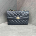 CHANEL Black Gold Lambskin Accordion Flap Bag