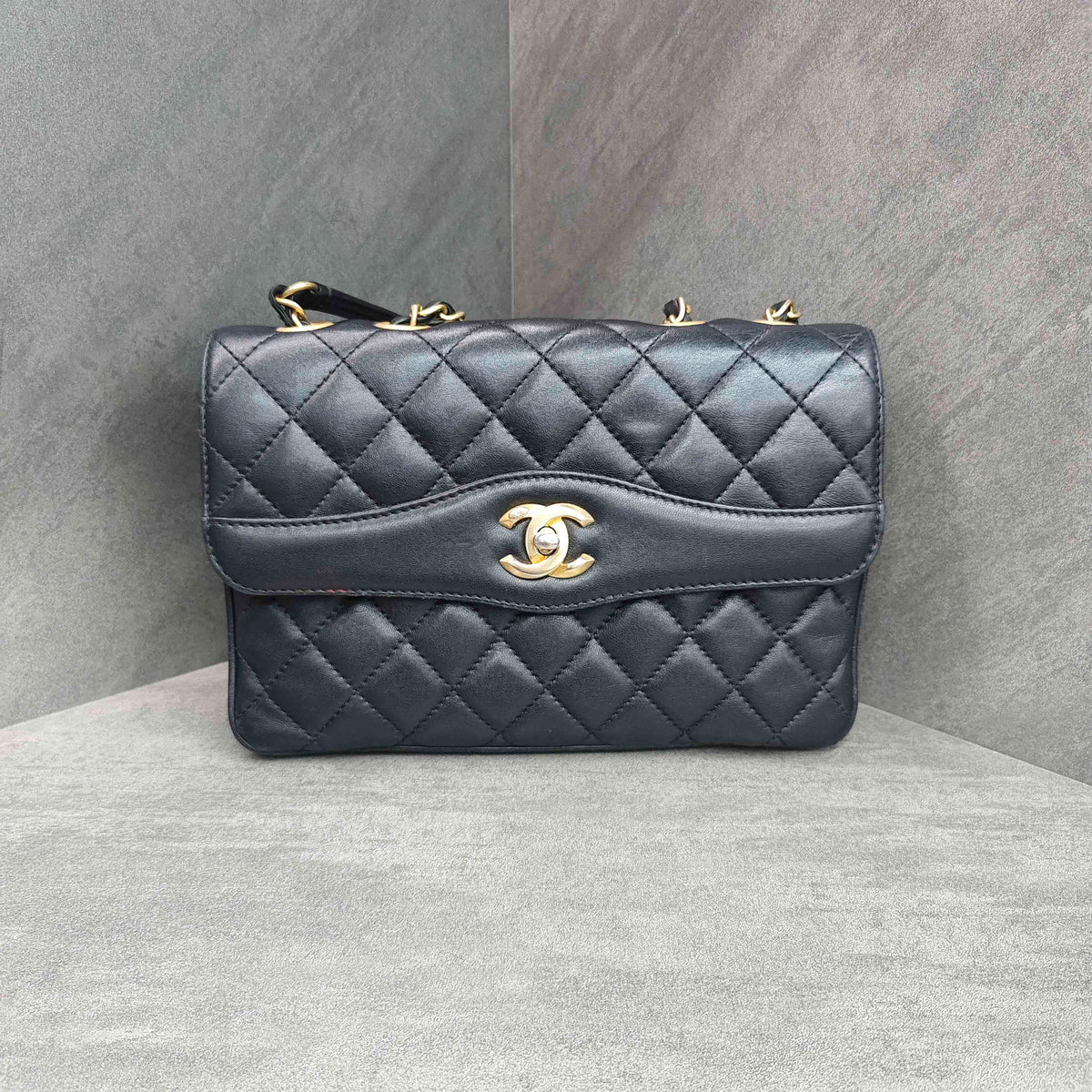 CHANEL Black Gold Lambskin Accordion Flap Bag
