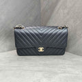 CHANEL Classic Flap Bag Black Chevron Caviar Leather Gold Hardware