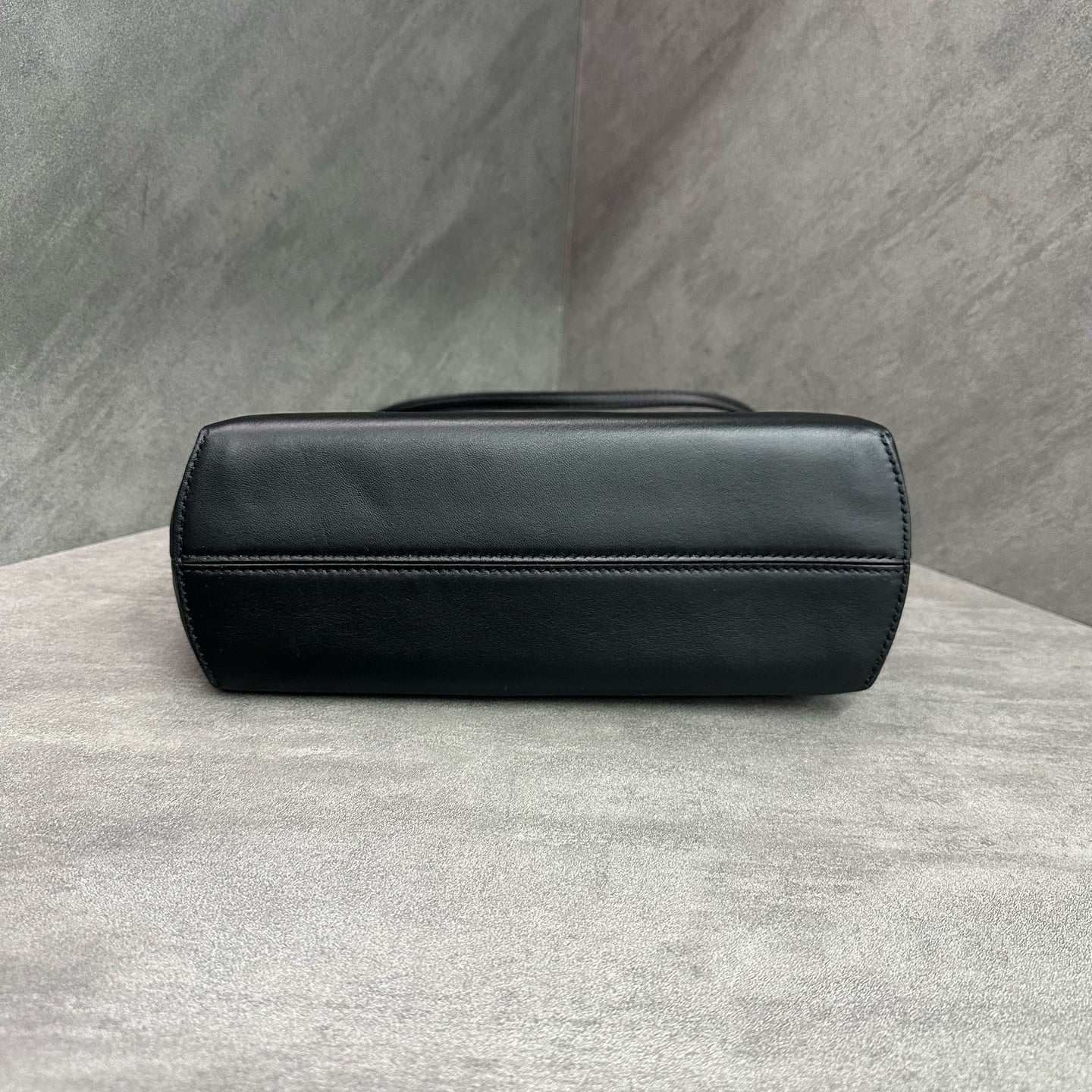 Fendi First handbag Dinner bag is made of soft black Napa leather