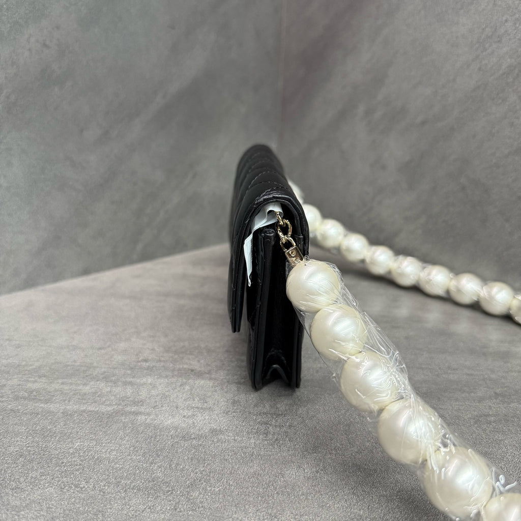 Chanel Chanel large pearl chain mini woc 31 open strap card in original condition