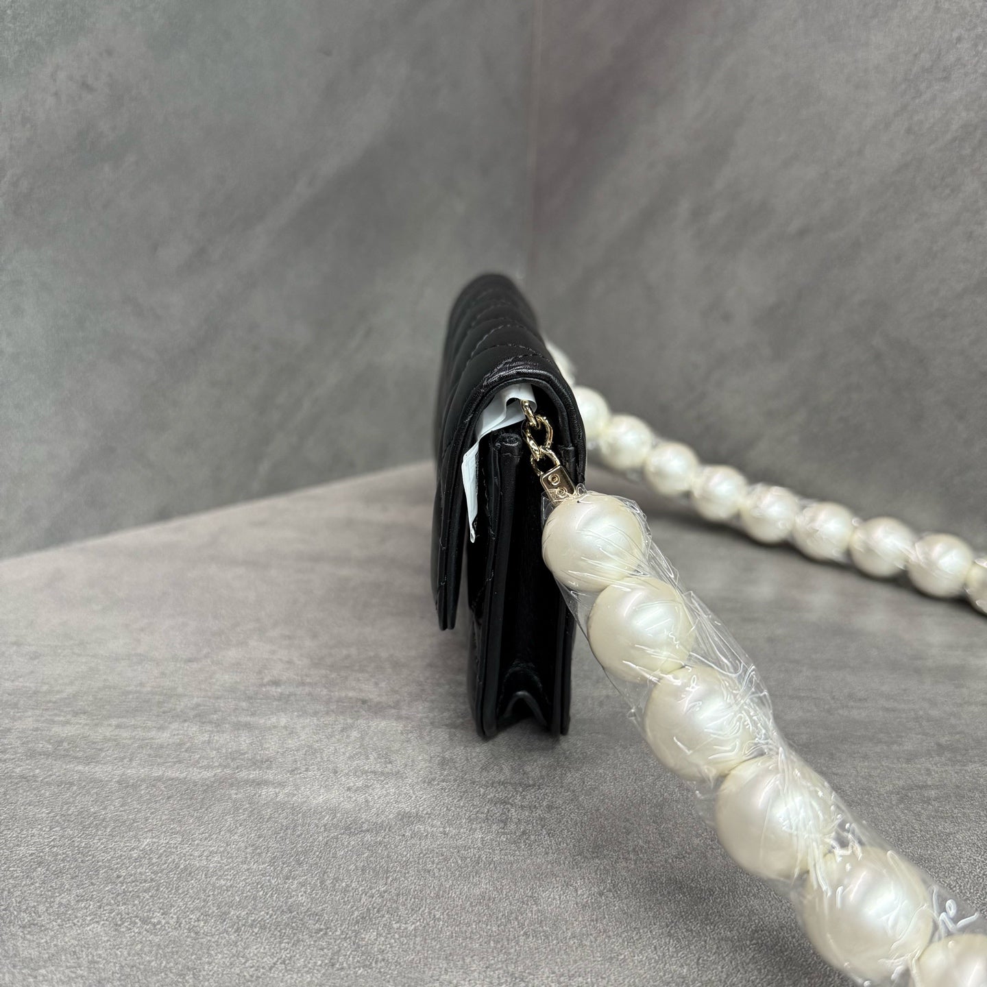 Chanel Chanel large pearl chain mini woc 31 open strap card in original condition