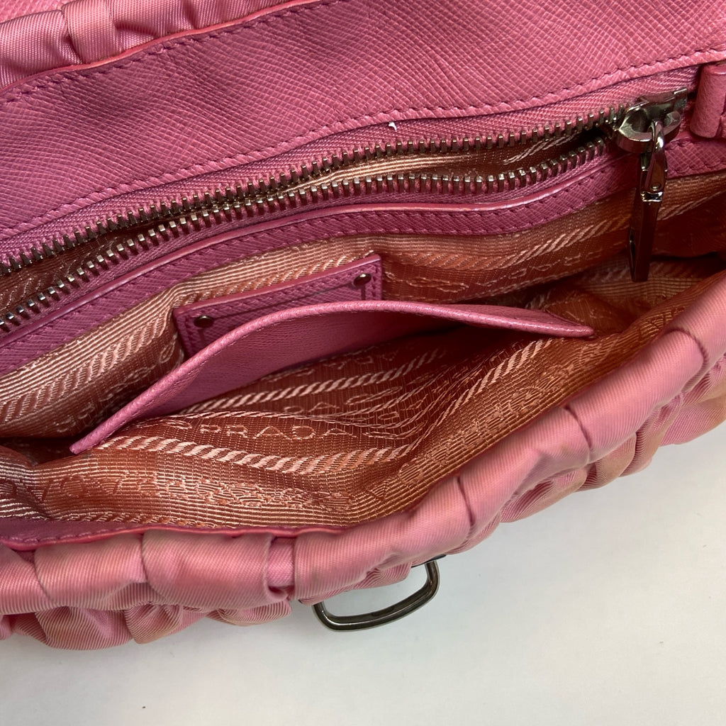 Prada Pink Pleated Chain Bag! Pink pleated parachute material shoulder underarm crossbody chain bag, paired with a silver lock. Size: 23*15.