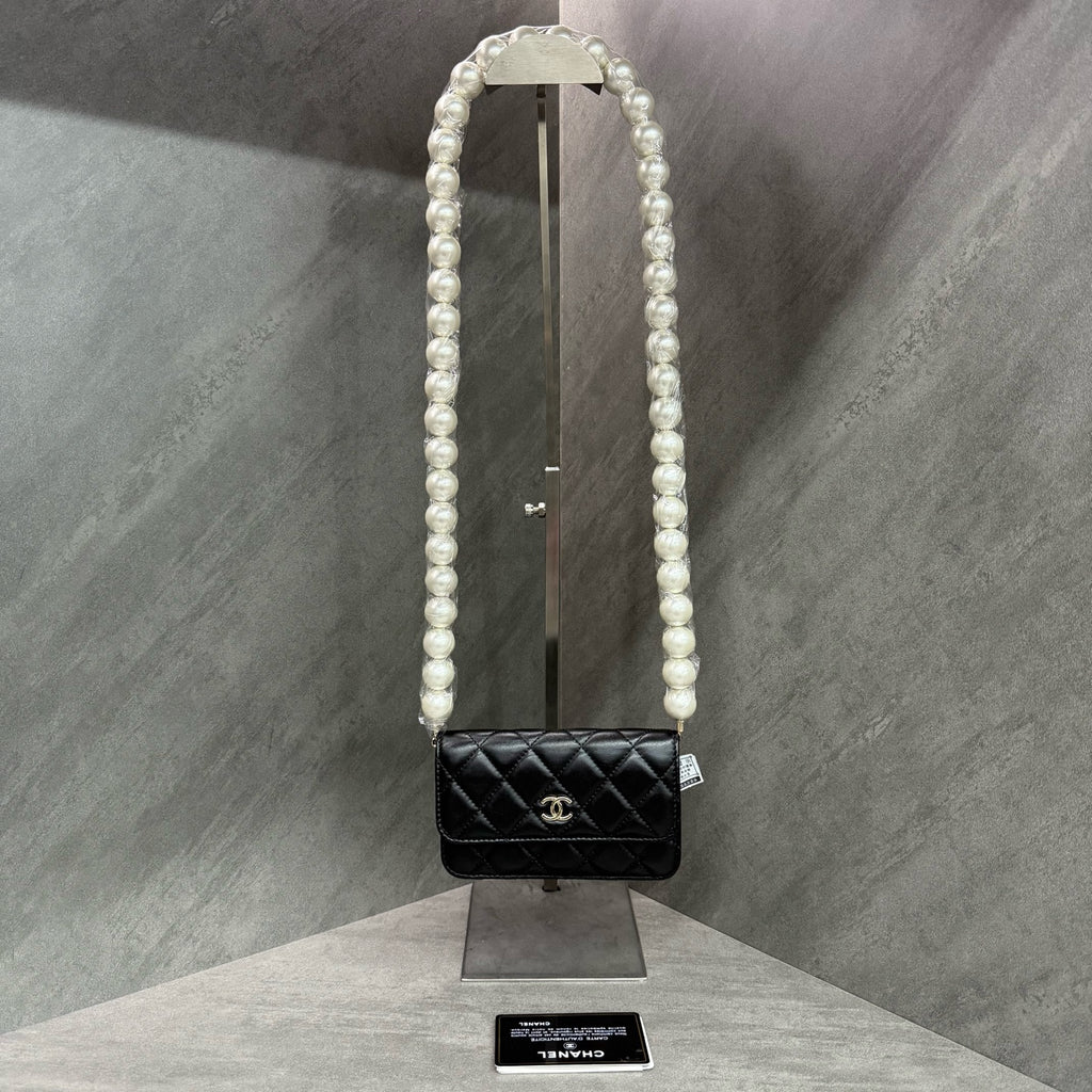 Chanel Chanel large pearl chain mini woc 31 open strap card in original condition