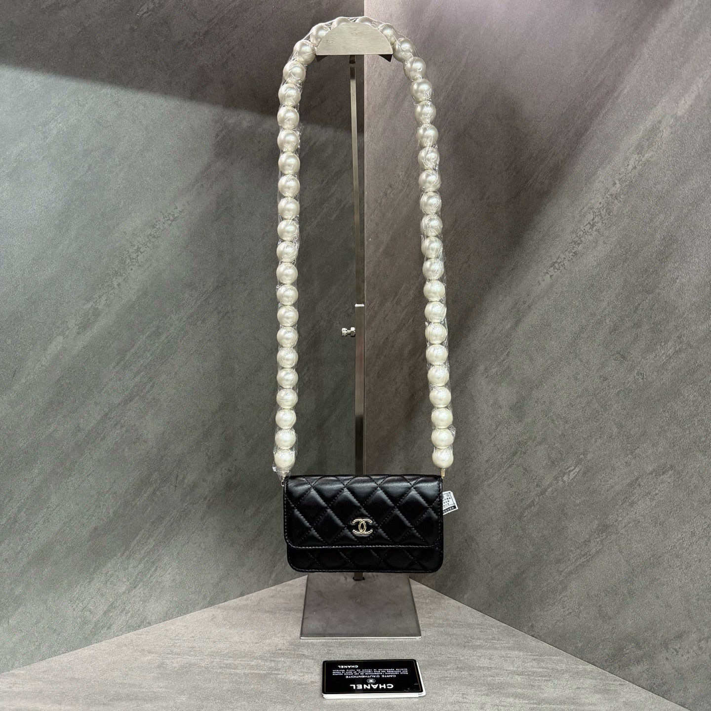 Chanel Chanel large pearl chain mini woc 31 open strap card in original condition