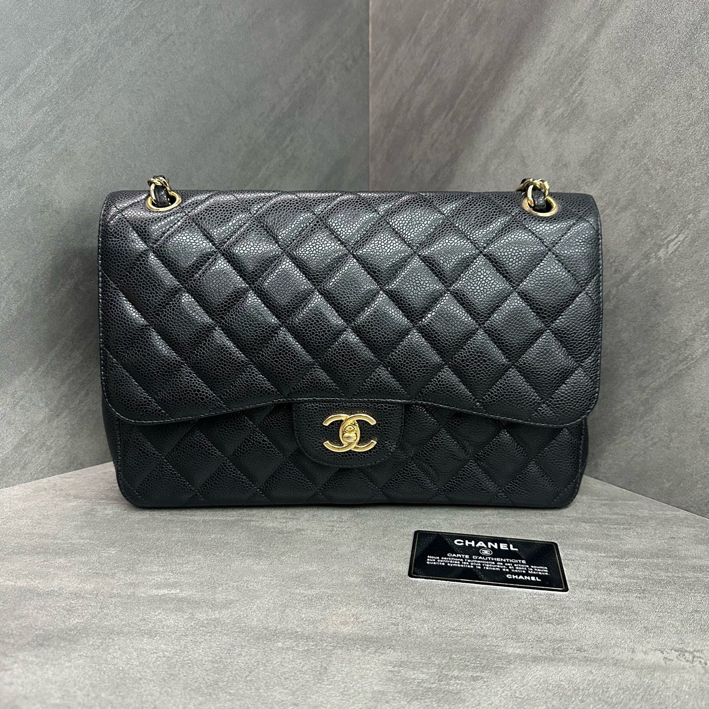 Chanel CF Jumbo black-grain calfskin chain bag in black and gold, 16 serial with authenticity card, structured silhouette, clean interior