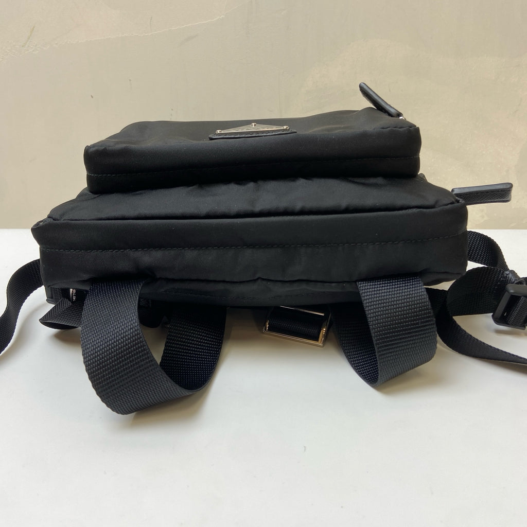 Prada Black and Silver Nylon Multifunctional Backpack Show Style, Backpack in 99% New Condition Dimensions: 22×17 Black and Silver Nylon Material