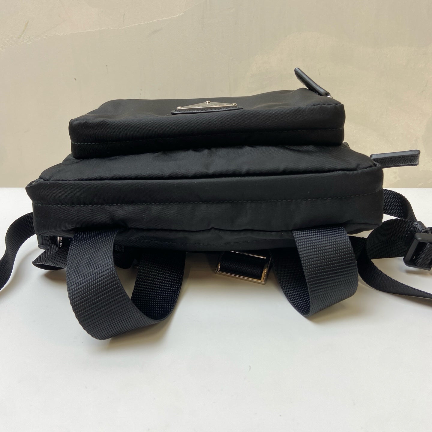 Prada Black and Silver Nylon Multifunctional Backpack Show Style, Backpack in 99% New Condition Dimensions: 22×17 Black and Silver Nylon Material