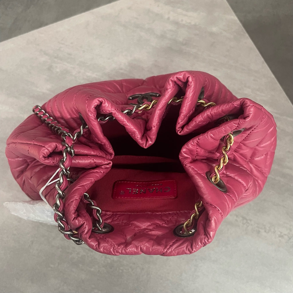 CHANEL Raspberry Pink V-Wave Mini Flap Bag with Crossbody Chain, 26 openings with card, in stock at a great price.