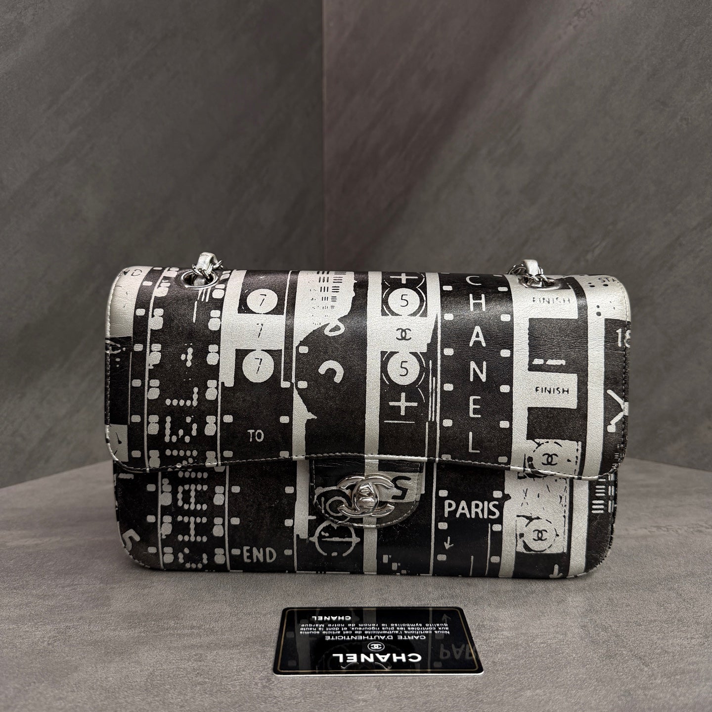Chanel CF Medium Black and White Newspaper Graffiti Bag, three-dimensional shape, clean interior.