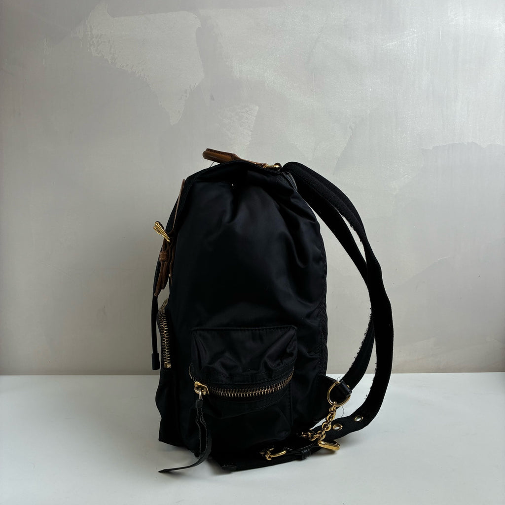 Burberry The Rucksack Series Classic Backpack with Engraving, Classic Black and Gold Color Scheme, Subtle and Sophisticated.