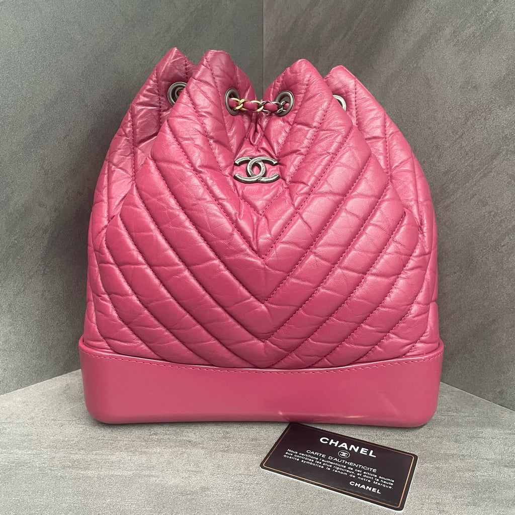 CHANEL Raspberry Pink V-Wave Mini Flap Bag with Crossbody Chain, 26 openings with card, in stock at a great price.