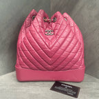 CHANEL Raspberry Pink V-Wave Mini Flap Bag with Crossbody Chain, 26 openings with card, in stock at a great price.