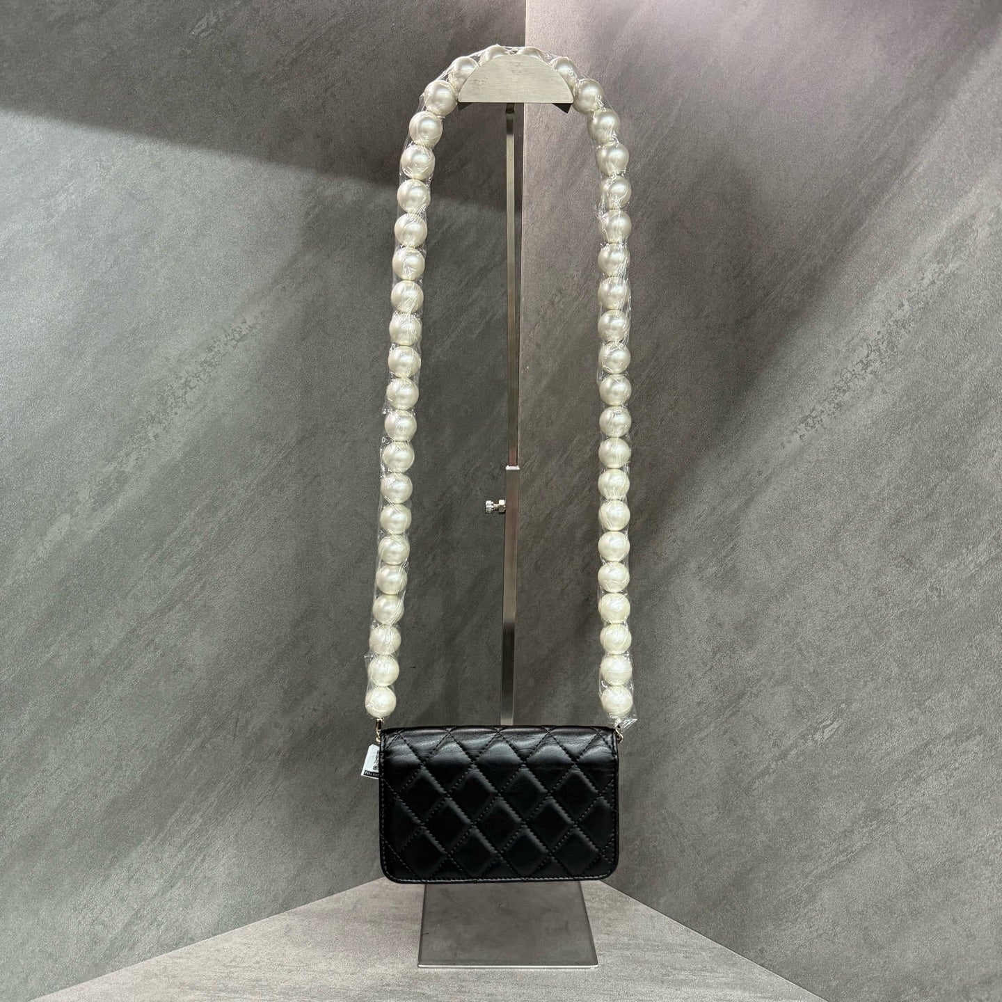Chanel Chanel large pearl chain mini woc 31 open strap card in original condition