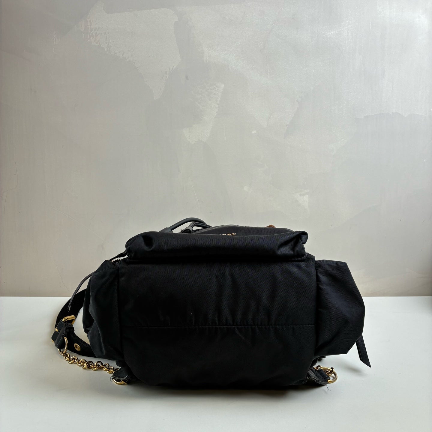 Burberry The Rucksack Series Classic Backpack with Engraving, Classic Black and Gold Color Scheme, Subtle and Sophisticated.