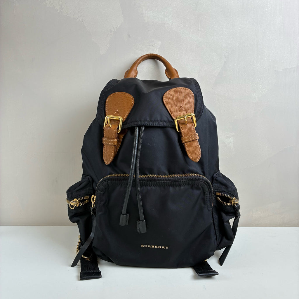 Burberry The Rucksack Series Classic Backpack with Engraving, Classic Black and Gold Color Scheme, Subtle and Sophisticated.