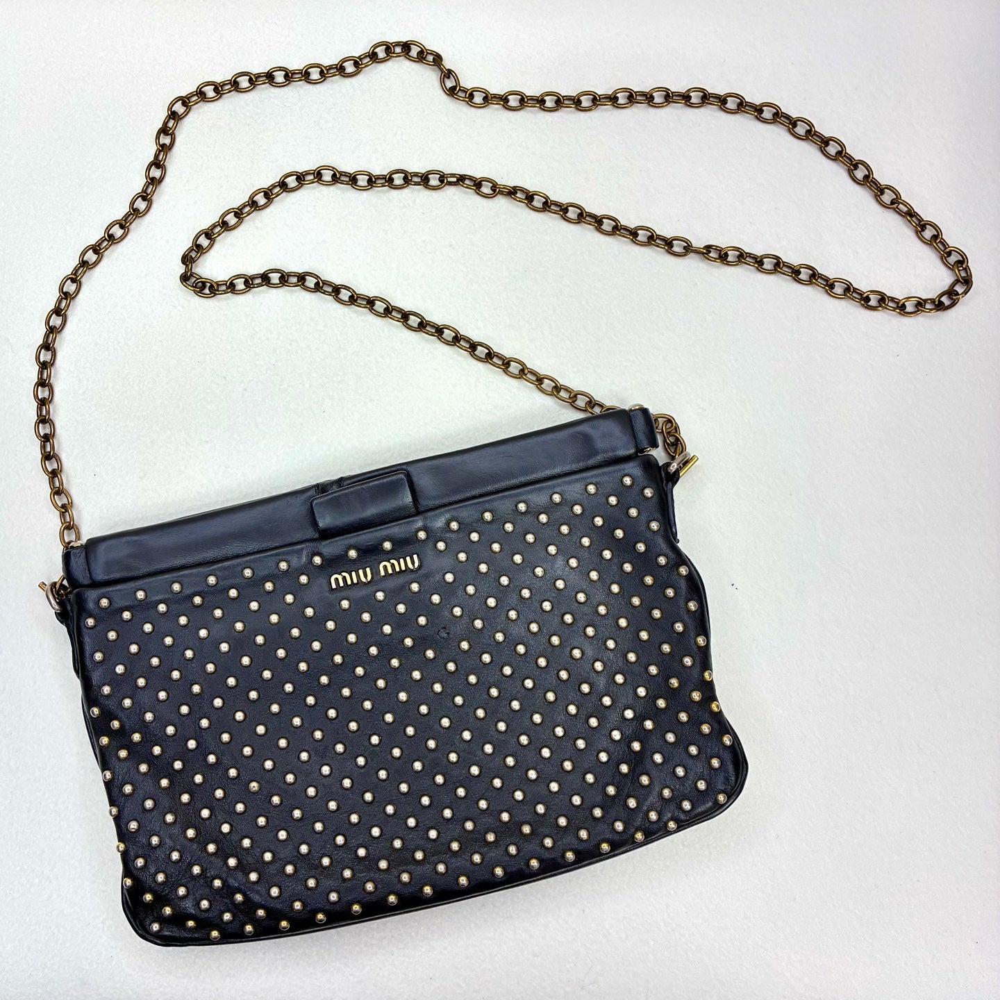 Miu Miu 95% new black studded clutch with gold stud embellishments, size: 18*14*5cm.