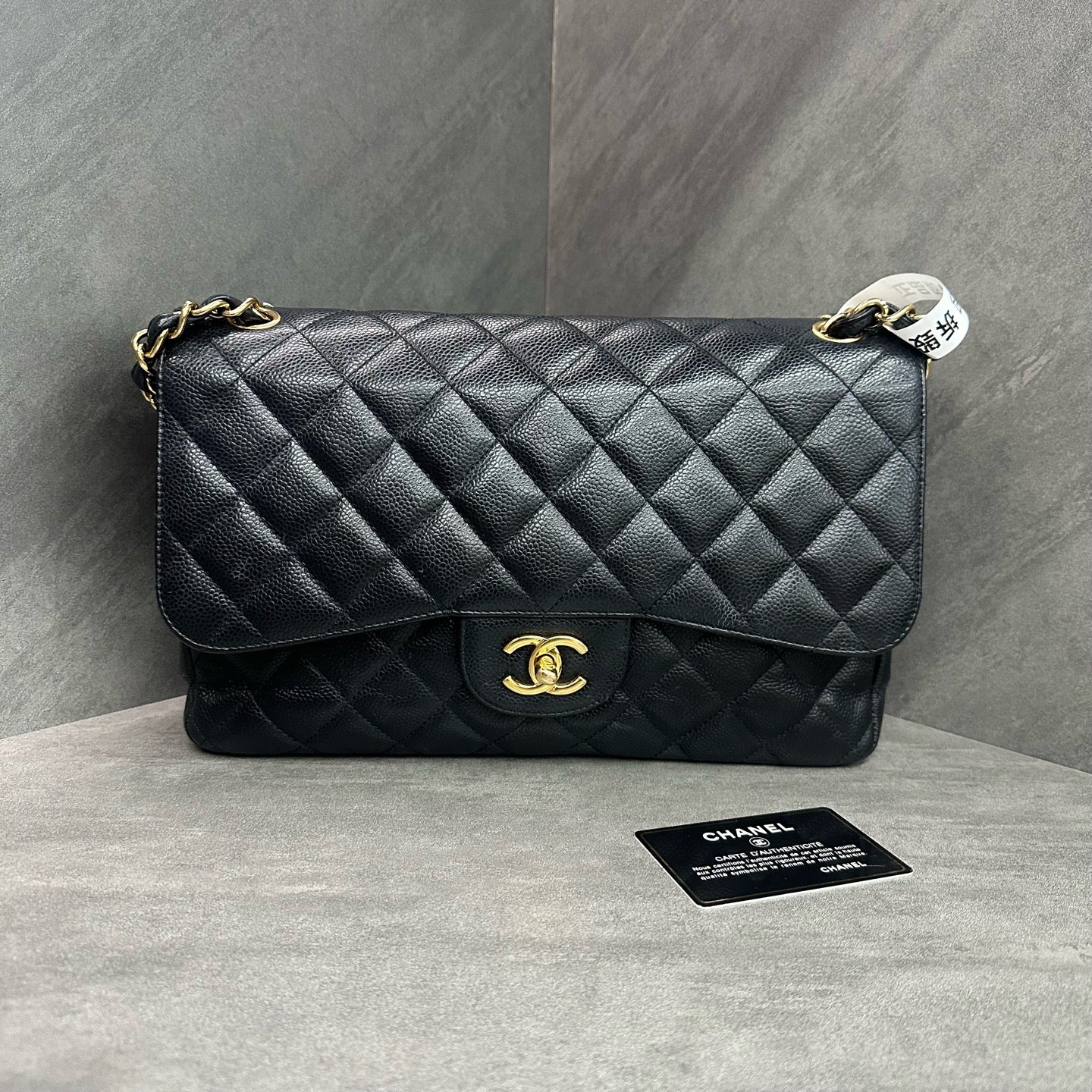 Chanel CF Jumbo black gold-tone clasp caviar leather chain bag, 24-series with authenticity card, structured silhouette, clean interior