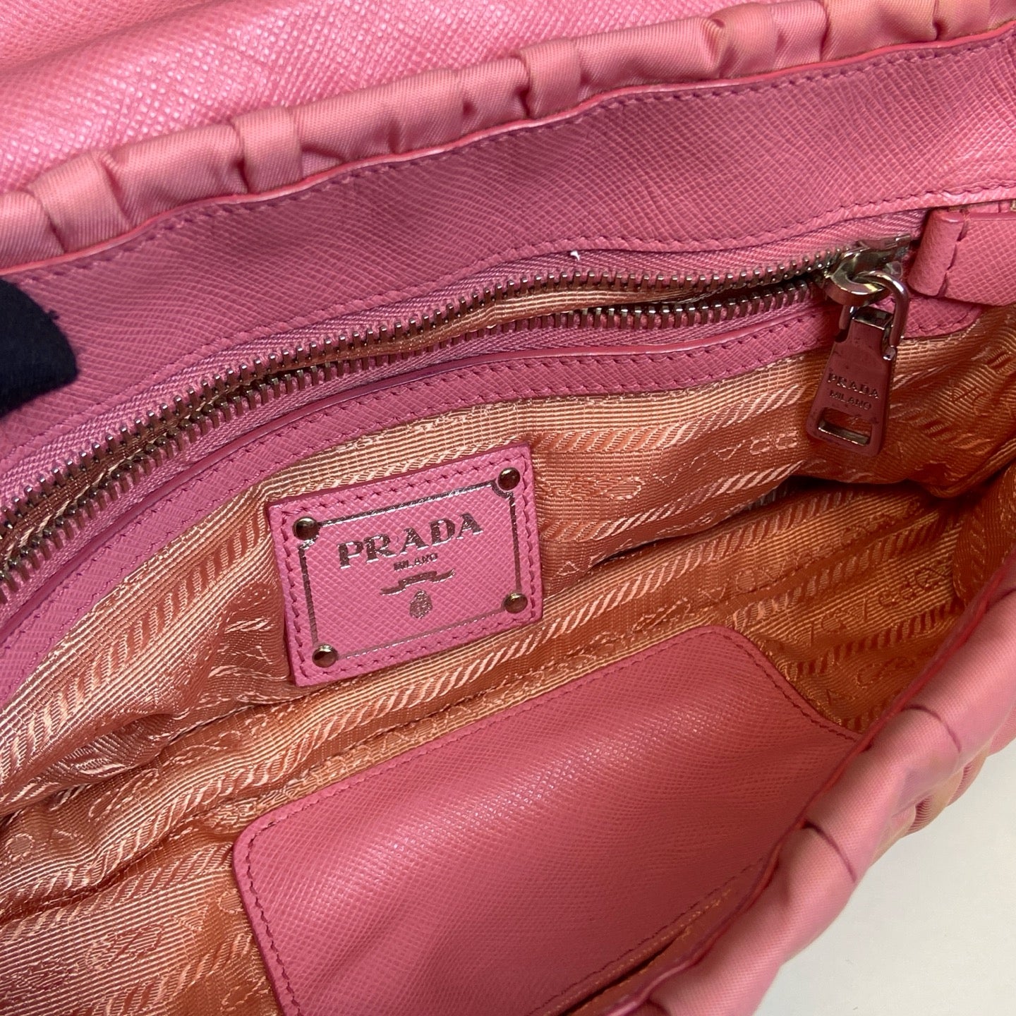 Prada Pink Pleated Chain Bag! Pink pleated parachute material shoulder underarm crossbody chain bag, paired with a silver lock. Size: 23*15.
